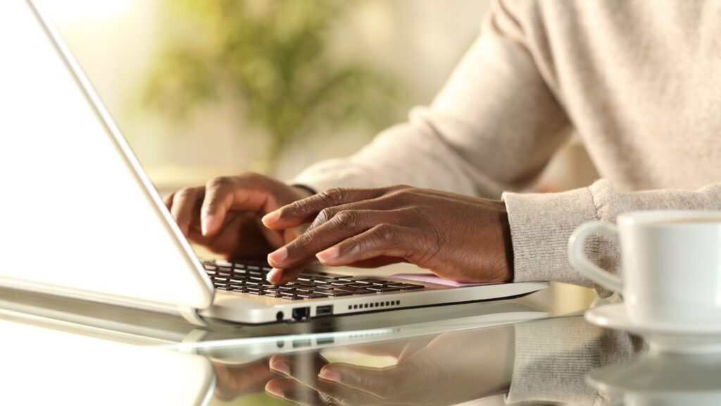 Person practicing SEO writing on laptop