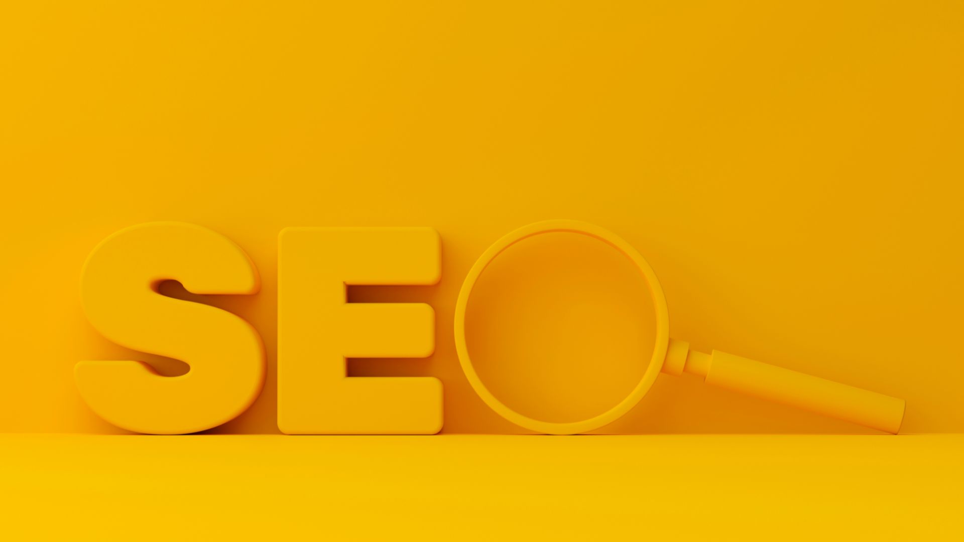 Yellow letters and a magnifying glass forming the word SEO on yellow background