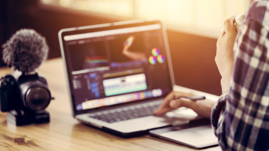 Person in front of laptop choosing a YouTube channel name