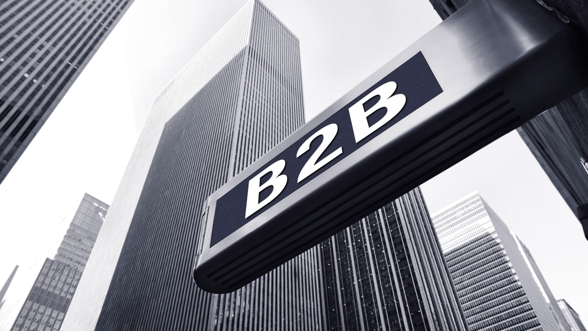 Street sign in front of skyscrapers with "B2B" written on it.