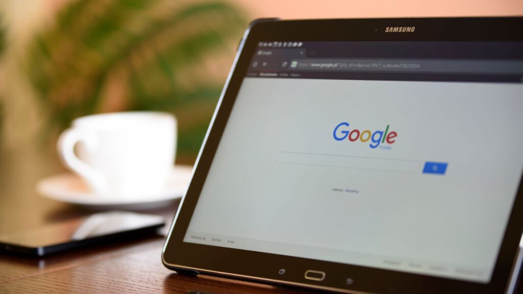 Tablet on desk with Google starting page on the screen.