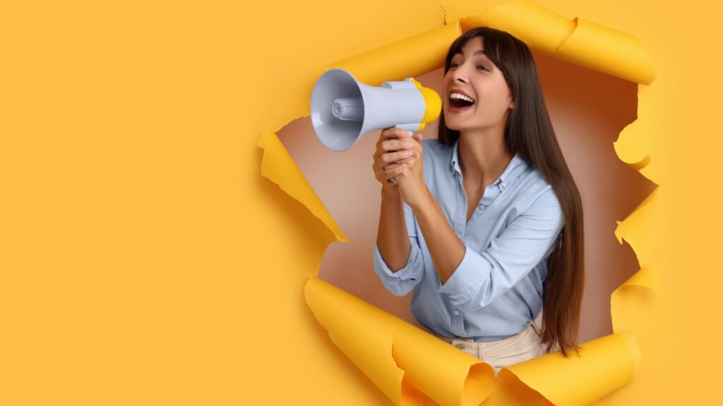 Woman holding megaphone to promote YouTube videos