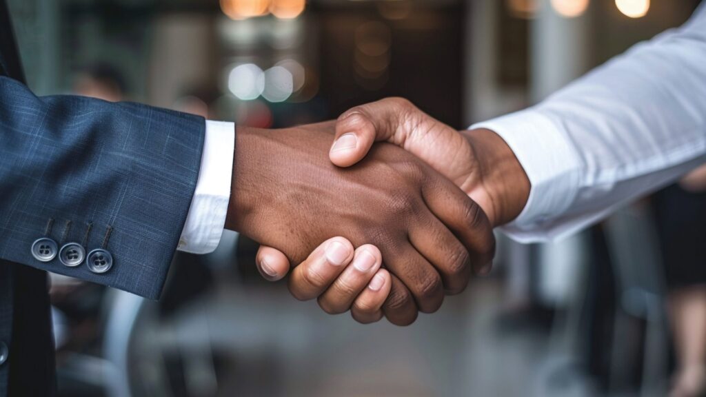 Salesman and client shaking hands