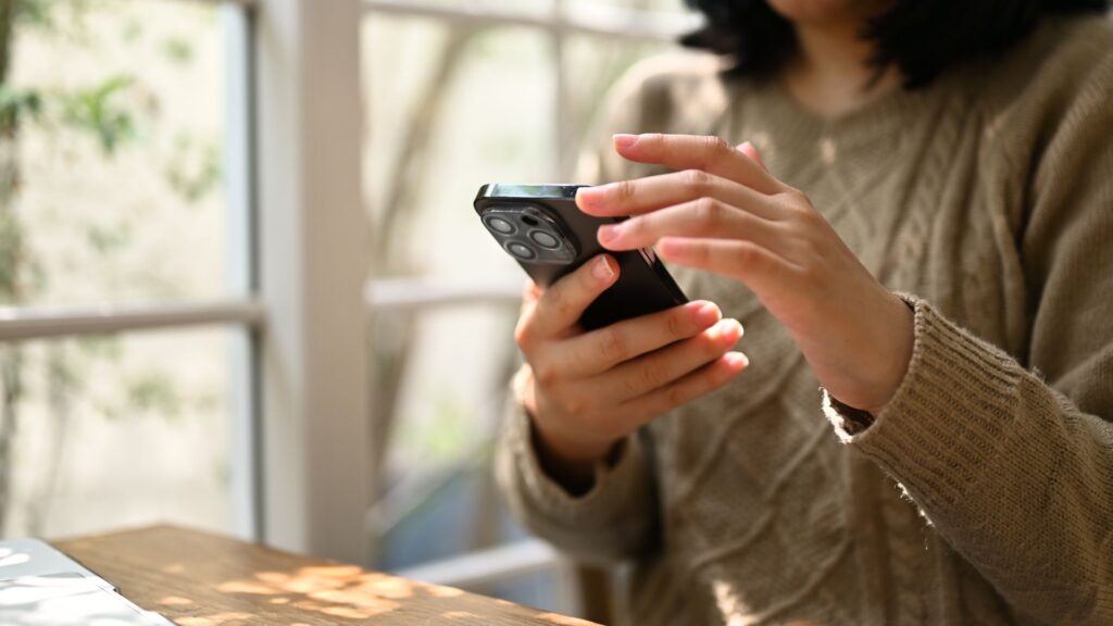 Threads user scrolling on smartphone.