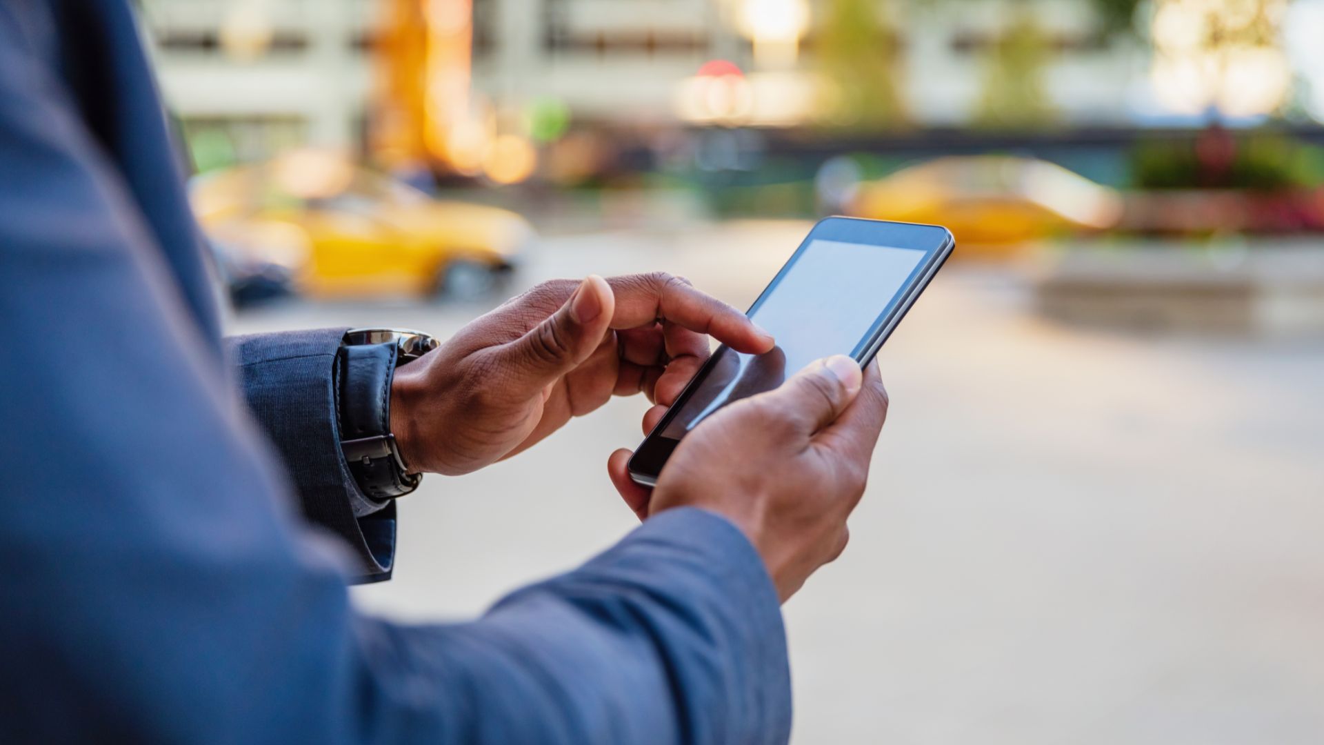 Uber user ordering a taxi from his smartphone.