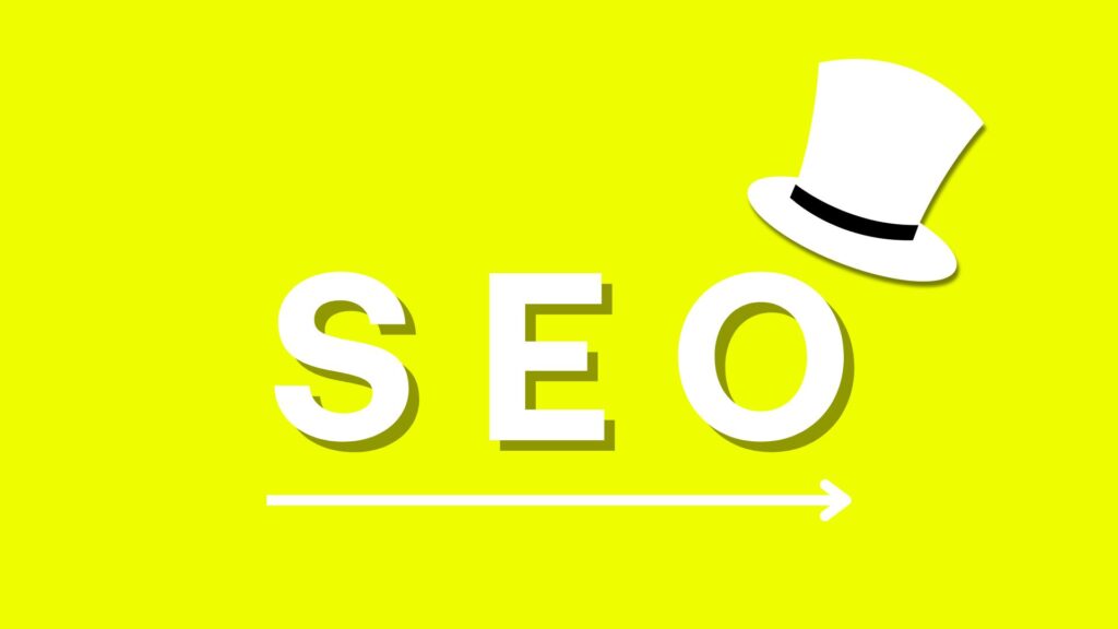 A white hat with the word SEO written below it on yellow background